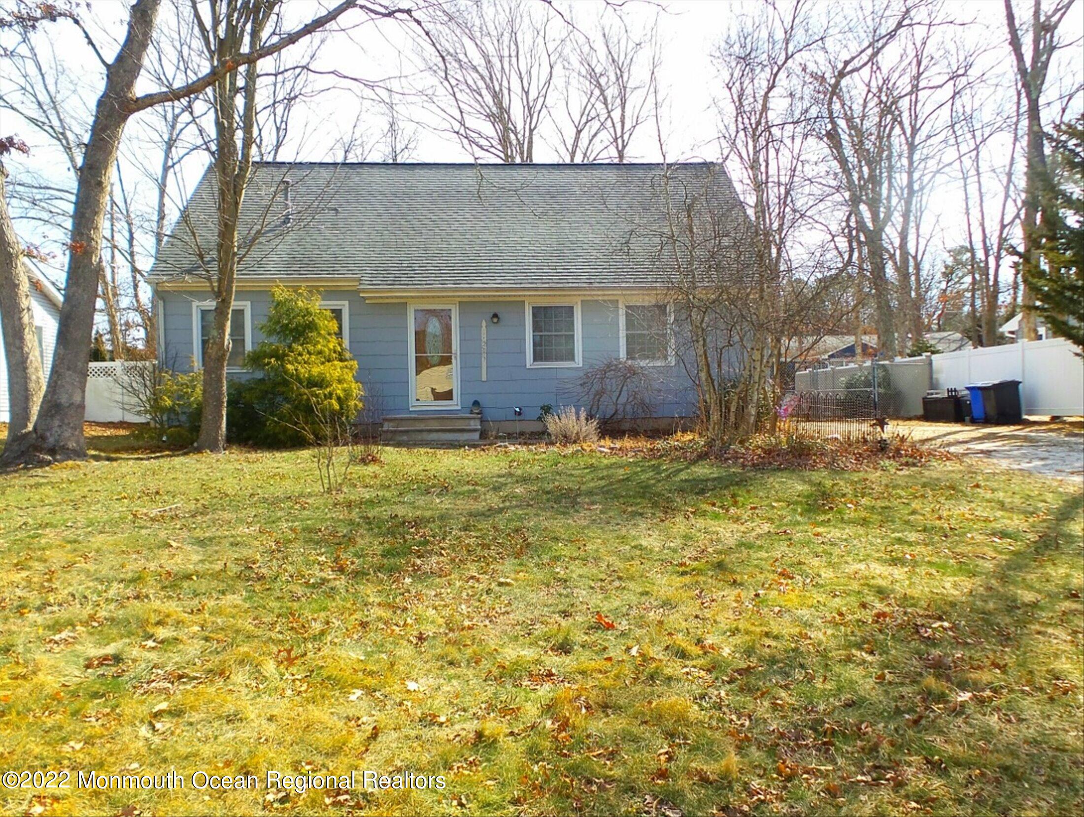 156 Topside Road Manahawkin, NJ 08050 - Photo 1 of 19 a view of a house with a yard covered with snow