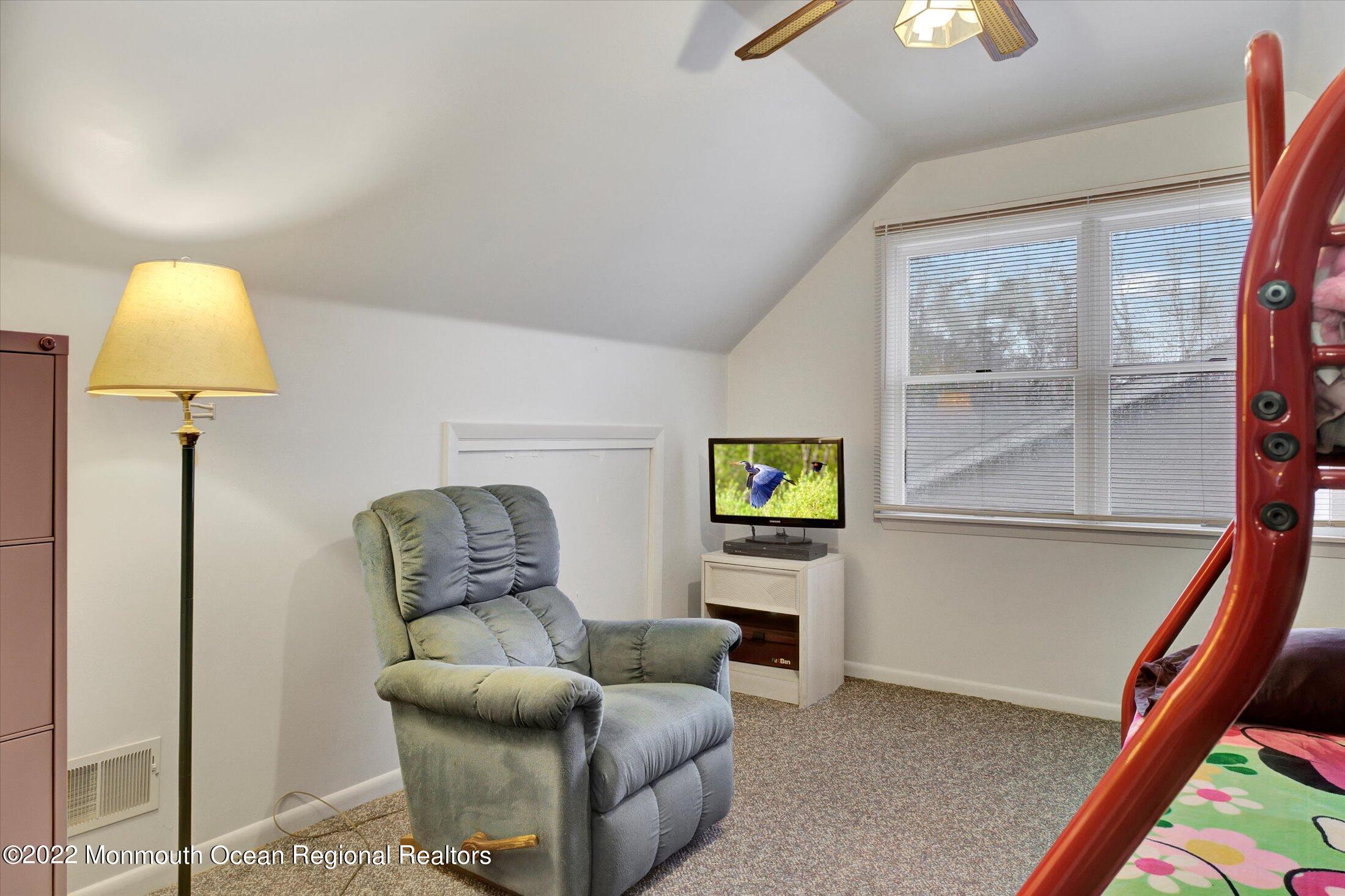156 Topside Road Manahawkin, NJ 08050 - Photo 11 of 19 a living room with furniture and a lamp