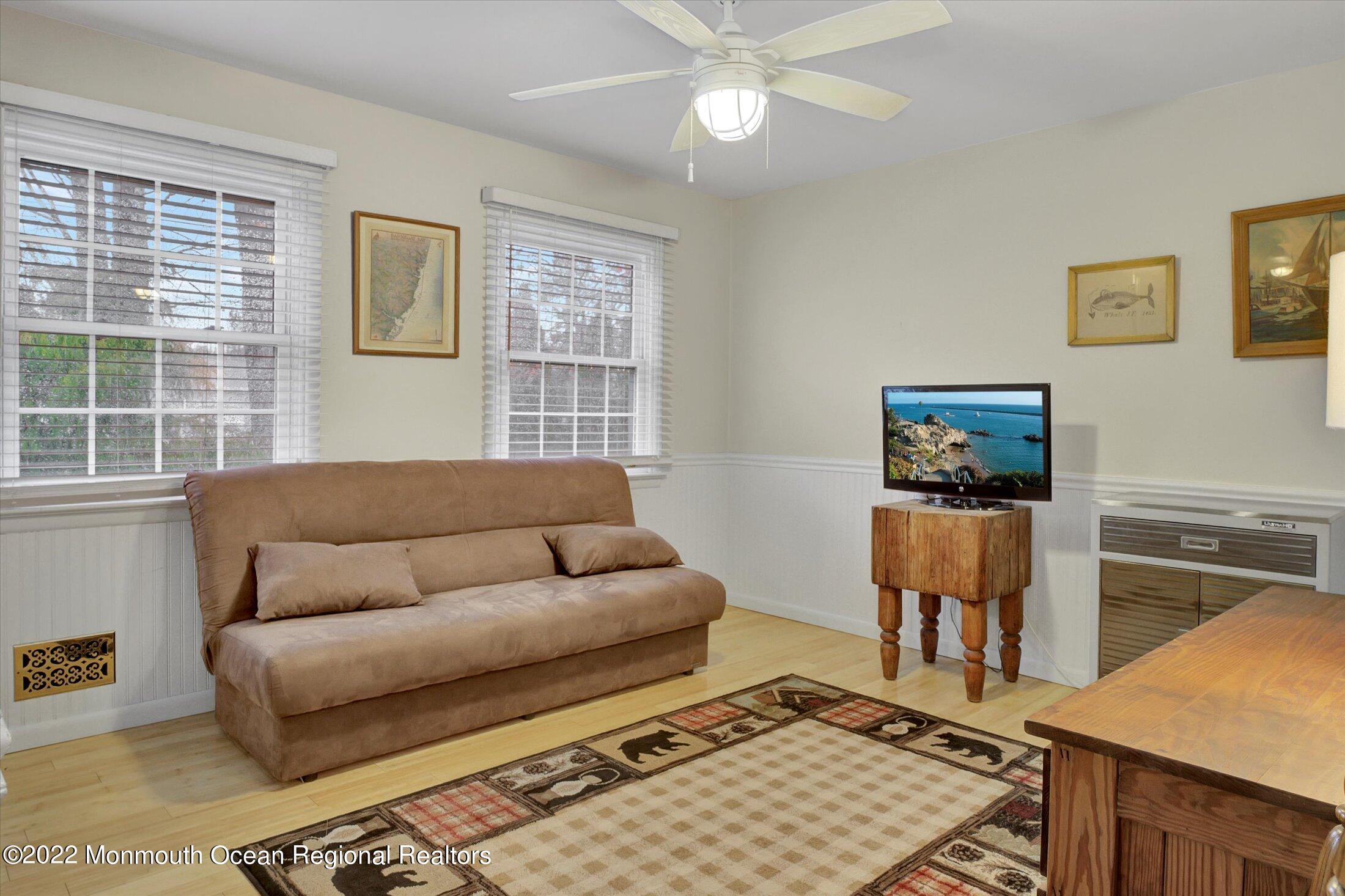 156 Topside Road Manahawkin, NJ 08050 - Photo 12 of 19 a living room with furniture and a window