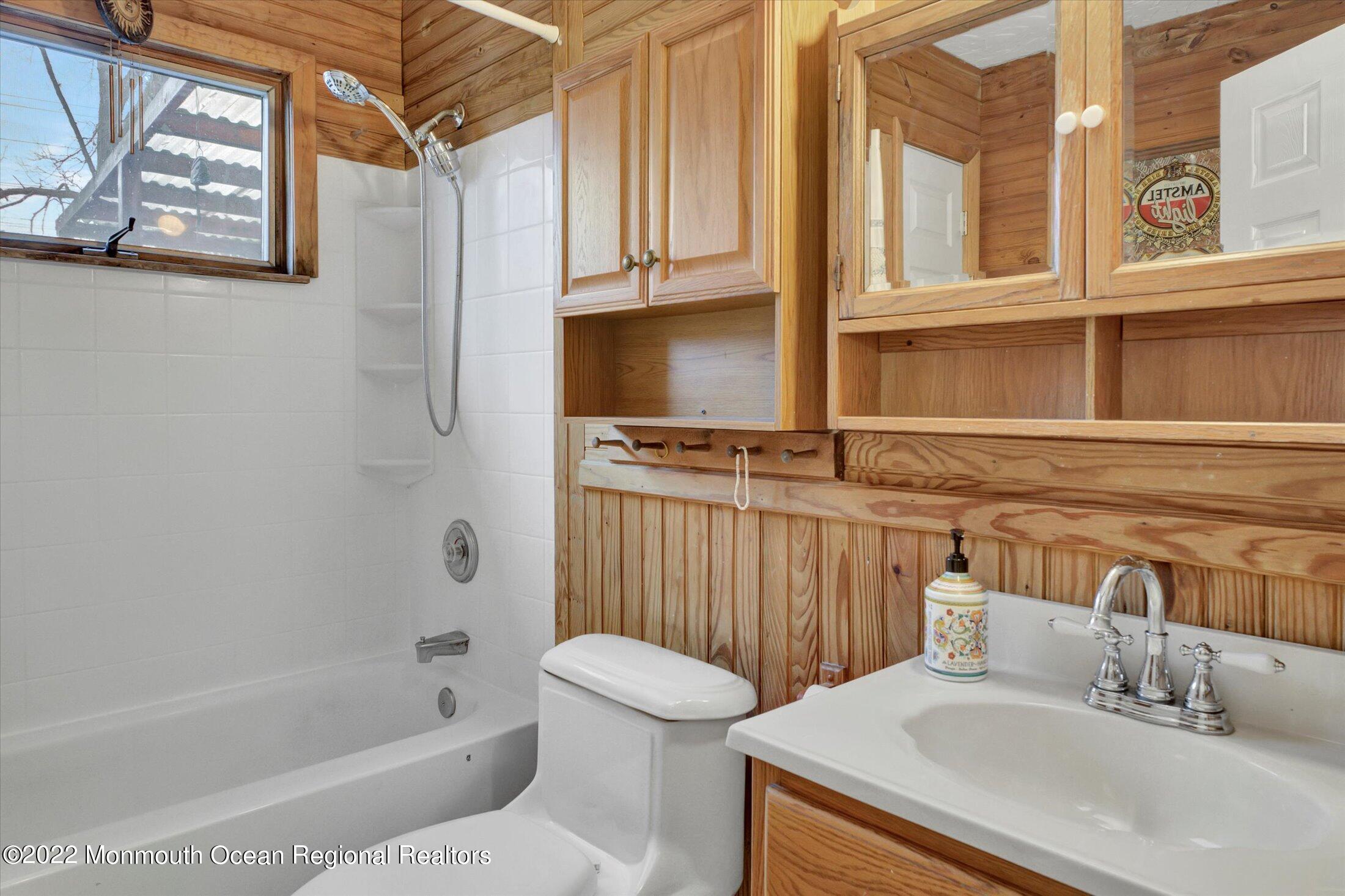 156 Topside Road Manahawkin, NJ 08050 - Photo 15 of 19 a bathroom with a sink a toilet and bathtub
