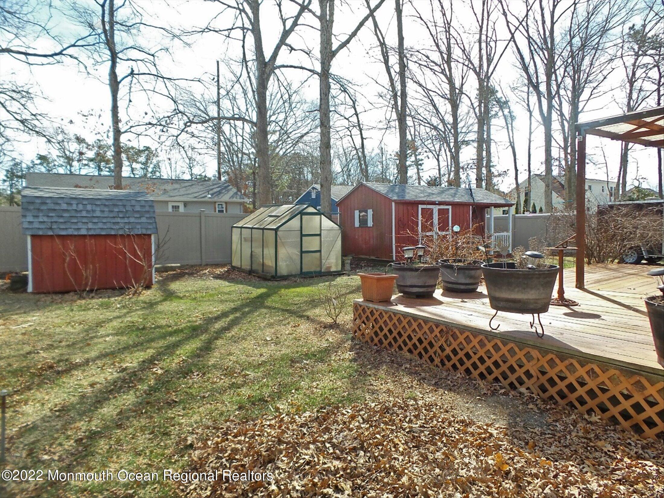 156 Topside Road Manahawkin, NJ 08050 - Photo 19 of 19 a front view of a house with garden