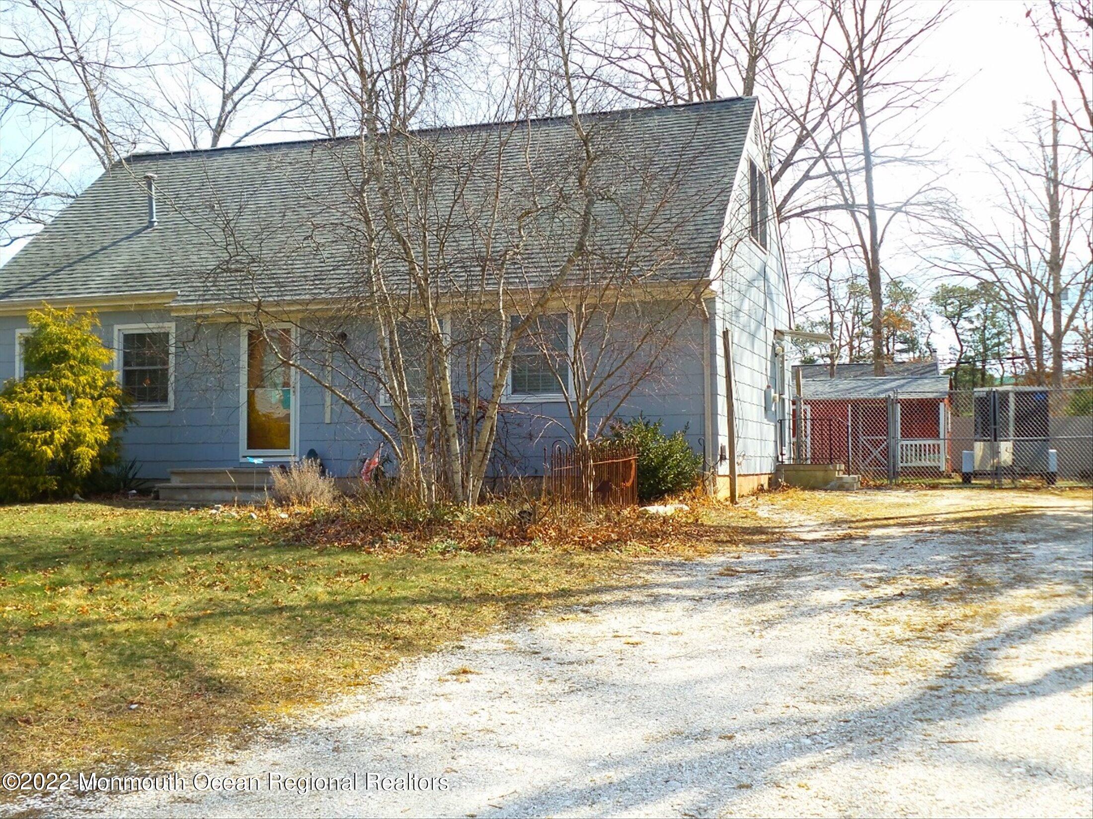 156 Topside Road Manahawkin, NJ 08050 - Photo 2 of 19 a view of a house with a swimming pool