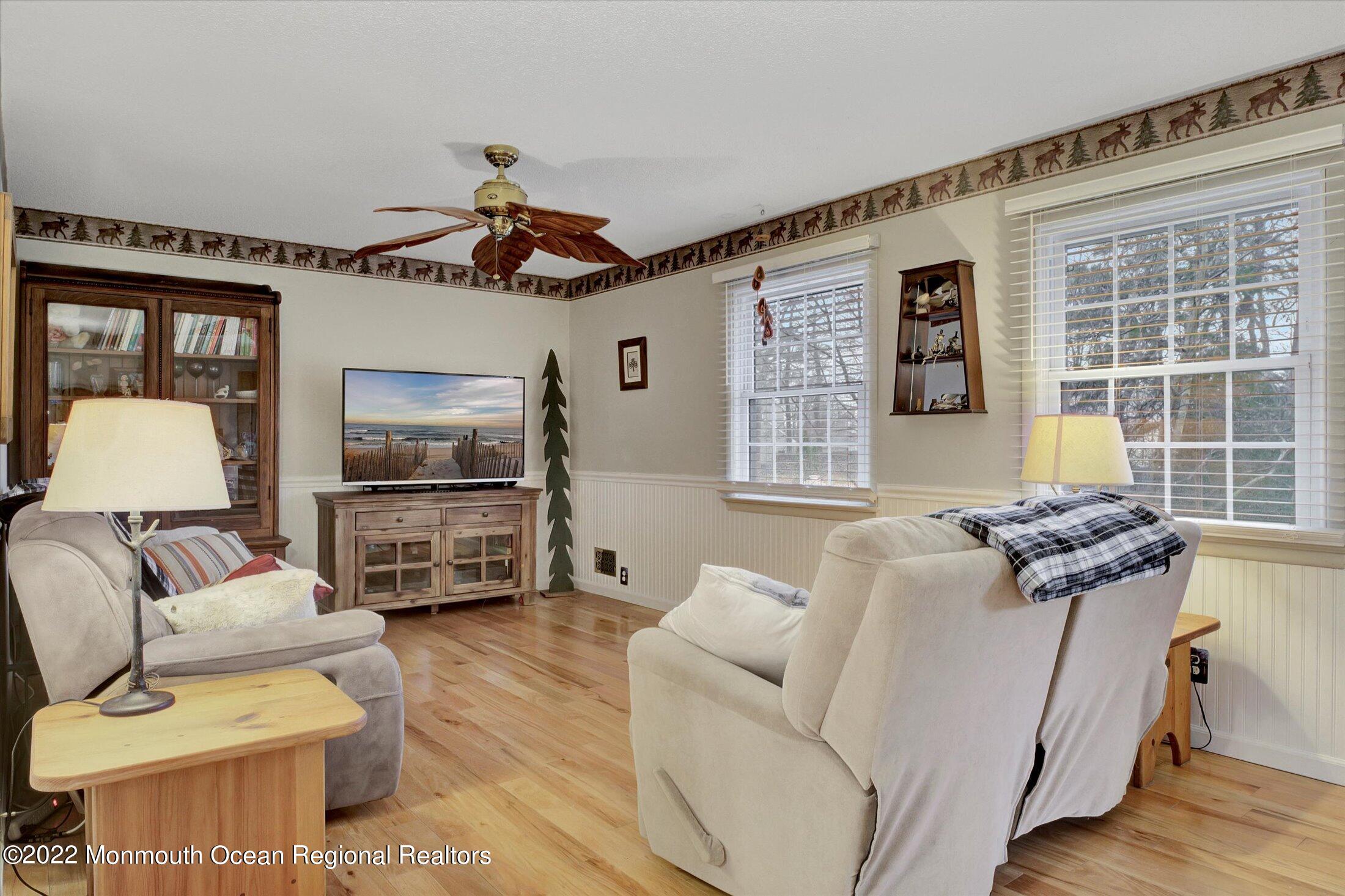 156 Topside Road Manahawkin, NJ 08050 - Photo 3 of 19 a living room with furniture and a flat screen tv
