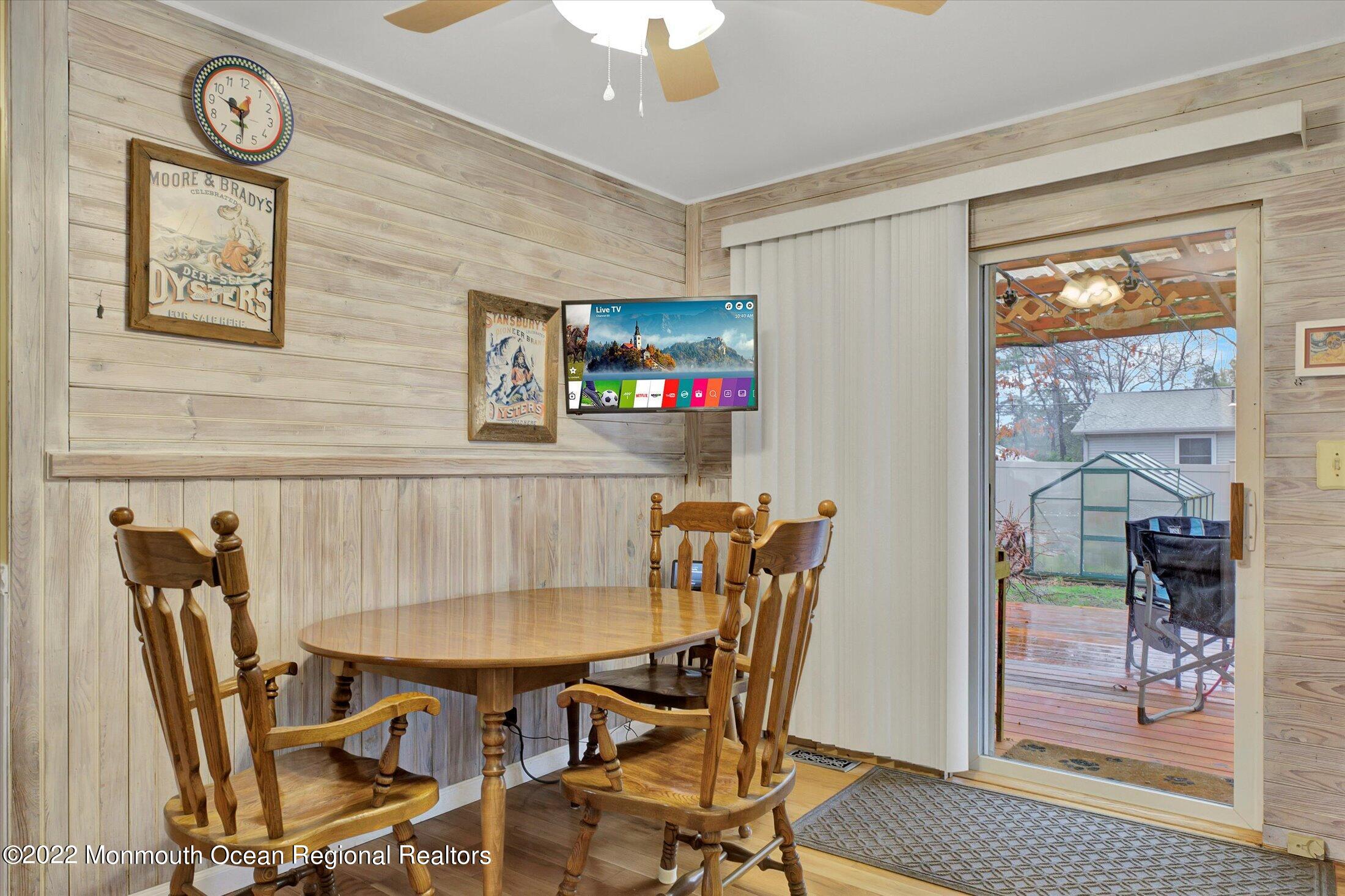 156 Topside Road Manahawkin, NJ 08050 - Photo 7 of 19 a view of a dining room with furniture and a chandelier