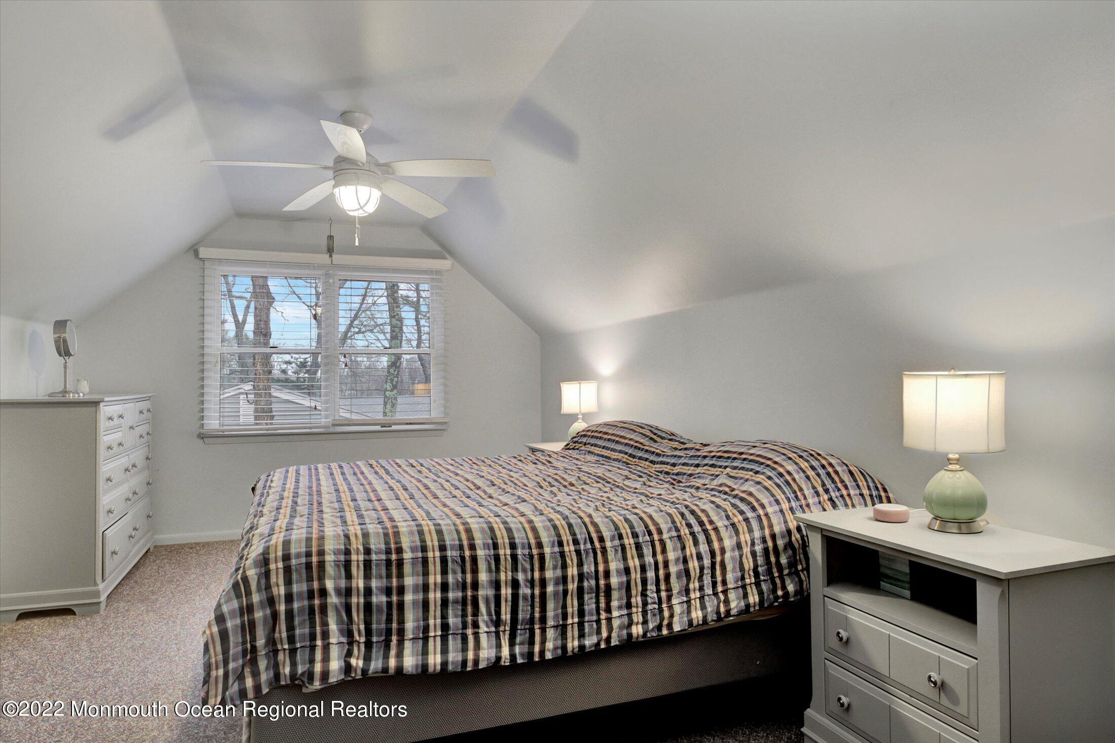 156 Topside Road Manahawkin, NJ 08050 - Photo 8 of 19 a bedroom with a bed and window