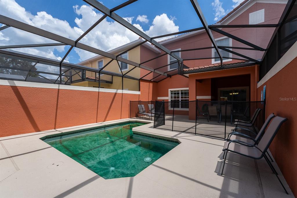 8957 Cat Palm Road Kissimmee, FL 34747 - Photo 14 of 25 a view of a backyard with sitting area