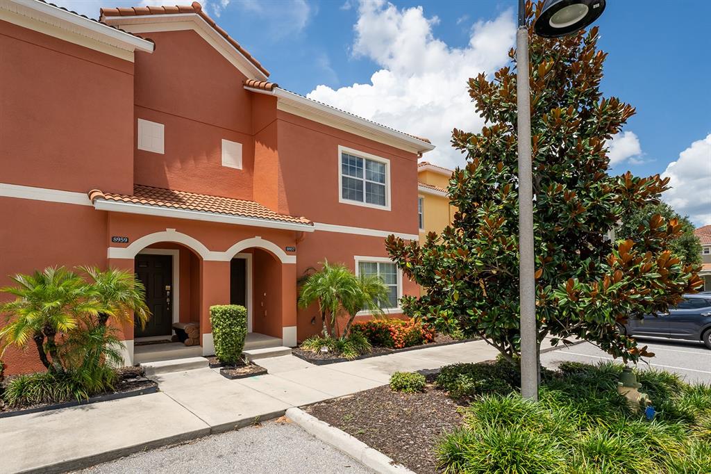 8957 Cat Palm Road Kissimmee, FL 34747 - Photo 25 of 25 a front view of a house with garden