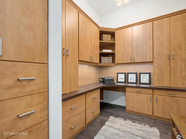 a kitchen with stainless steel appliances granite countertop a refrigerator a stove and a microwave