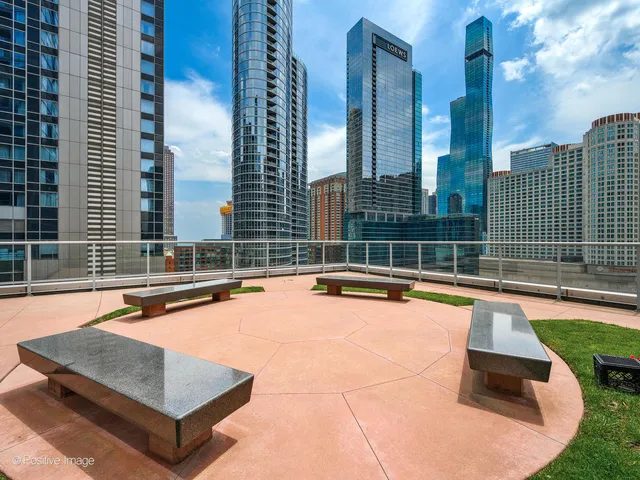 a view of a swimming pool with a lounge chairs