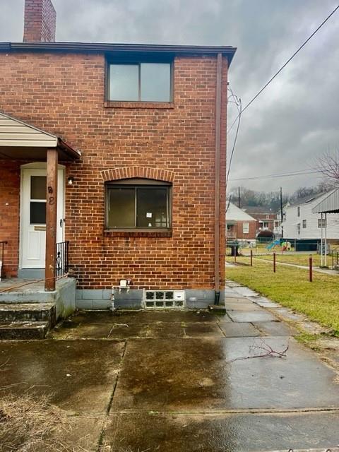 8 Rosamond Street McKees Rocks, PA 15136 - Photo 2 of 11 a front view of a house with a yard