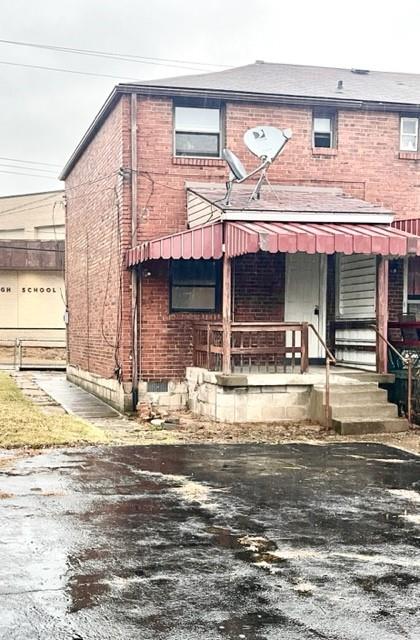 8 Rosamond Street McKees Rocks, PA 15136 - Photo 4 of 11 a front view of a house with swimming pool