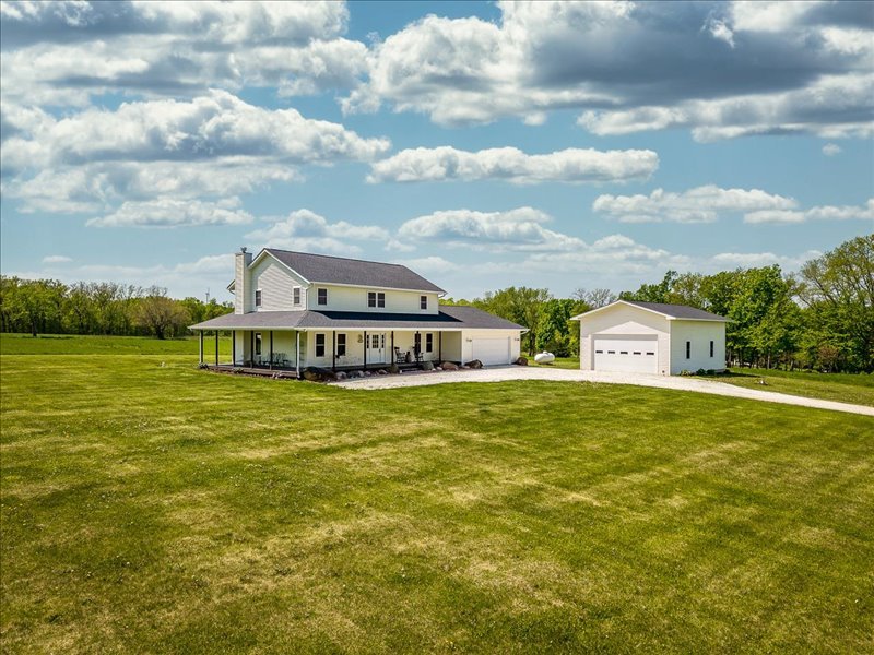 911.41 Melugins Compton, IL 61318 - Photo 2 of 67 a view of a house next to a big yard and large trees