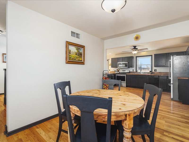 911.41 Melugins Compton, IL 61318 - Photo 25 of 67 a view of a dining room with furniture and wooden floor