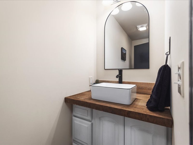 911.41 Melugins Compton, IL 61318 - Photo 28 of 67 a view of a bathroom with a sink and mirror