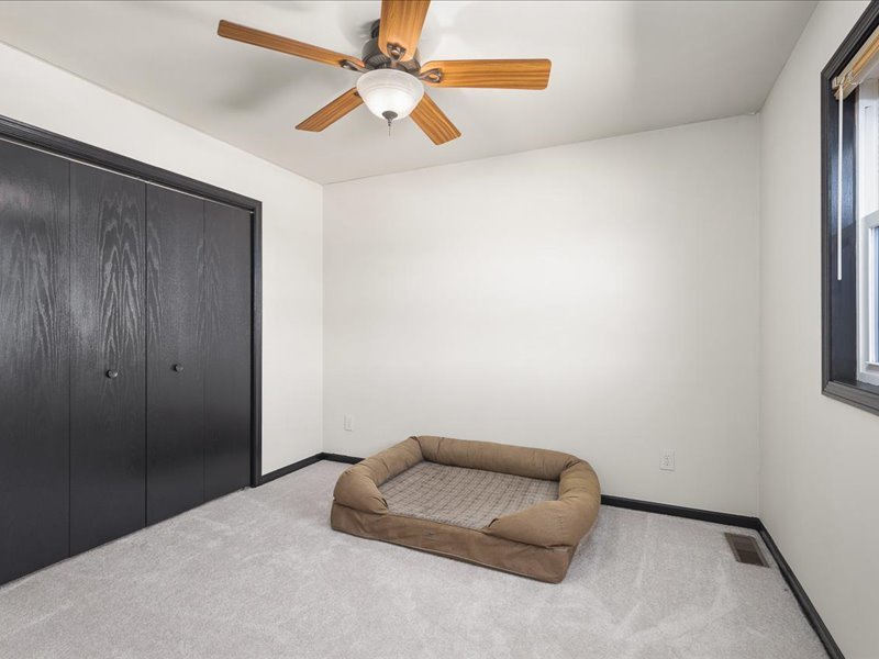 911.41 Melugins Compton, IL 61318 - Photo 40 of 67 an empty room with a ceiling fan and a window