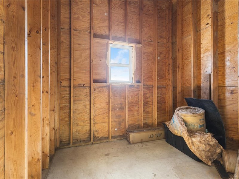 911.41 Melugins Compton, IL 61318 - Photo 48 of 67 a spacious bedroom with a bed and a chandelier
