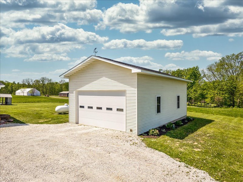 911.41 Melugins Compton, IL 61318 - Photo 7 of 67 a view of backyard of house and trees in the background