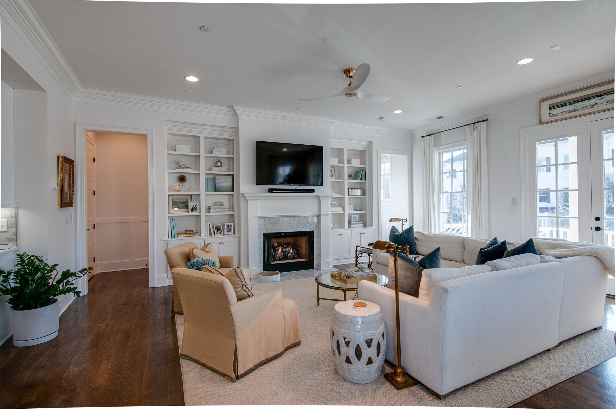 101 Front Street Franklin, TN 37064 - Photo 13 of 50 a living room with furniture a fireplace and a flat screen tv