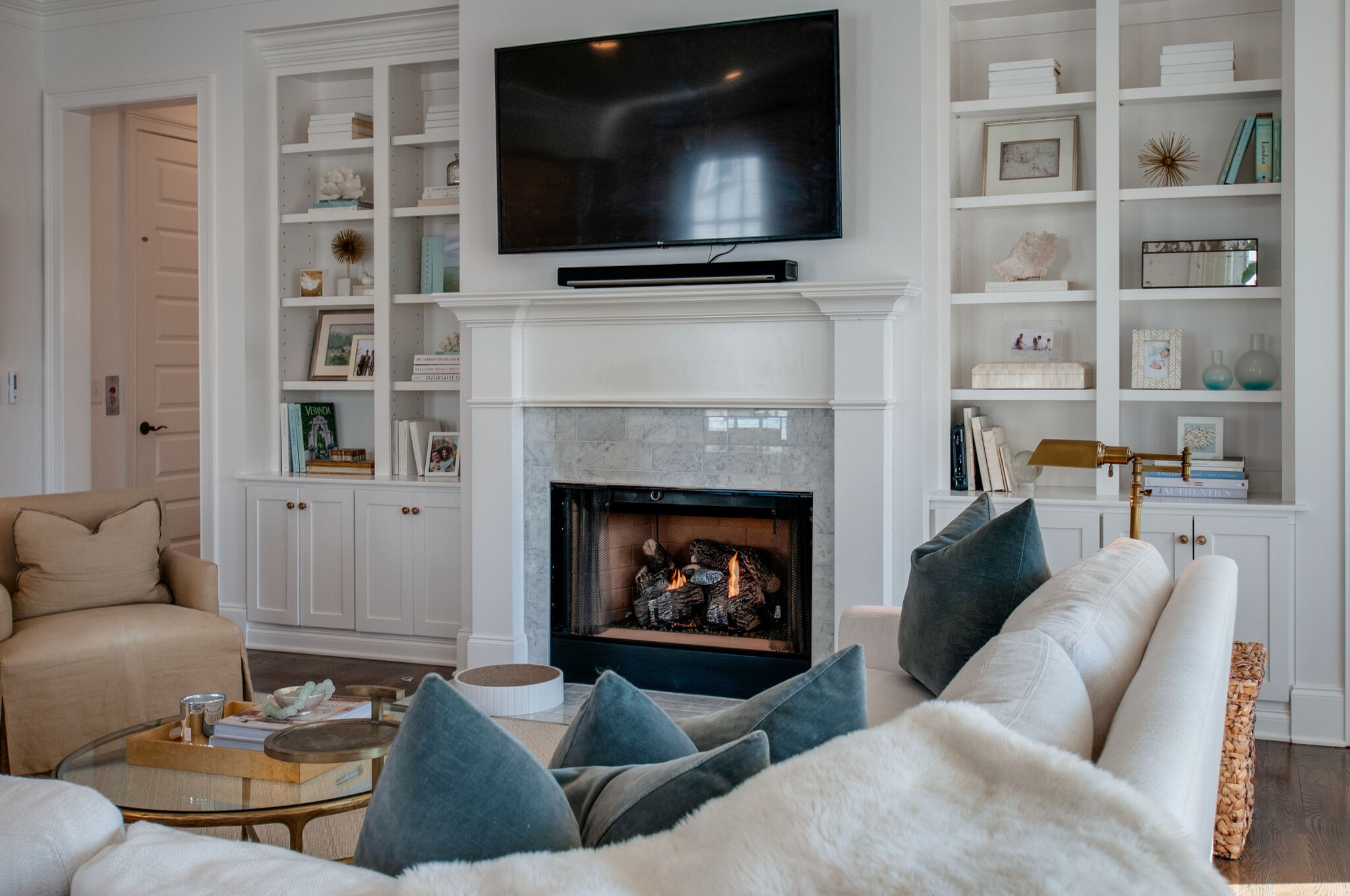 101 Front Street Franklin, TN 37064 - Photo 16 of 50 a living room with furniture a flat screen tv and a fireplace