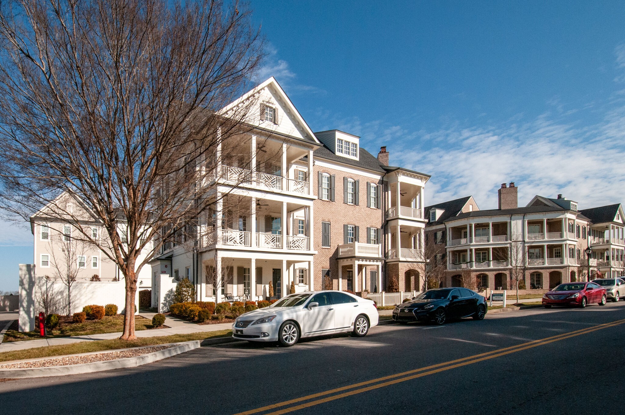 101 Front Street Franklin, TN 37064 - Photo 2 of 50 a front view of a building with lot of cars and trees