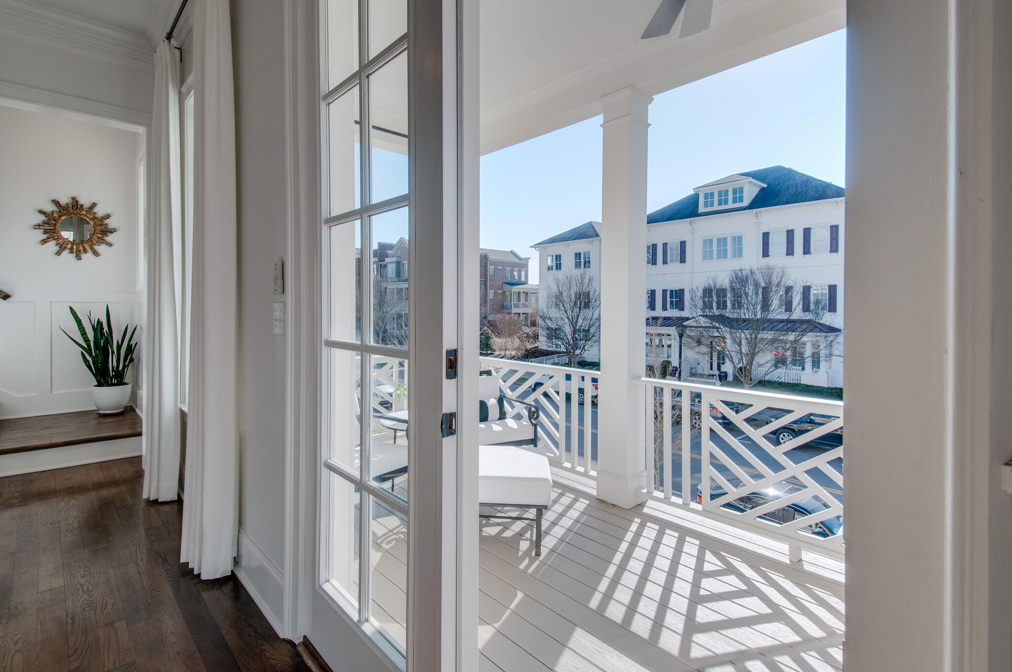 101 Front Street Franklin, TN 37064 - Photo 26 of 50 a view of staircase with a floor to ceiling window and wooden floor
