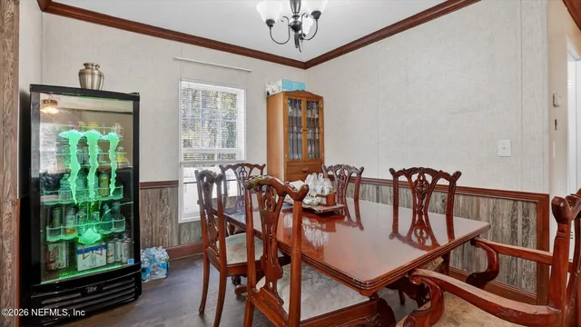 a view of a dining room with furniture window and outside view