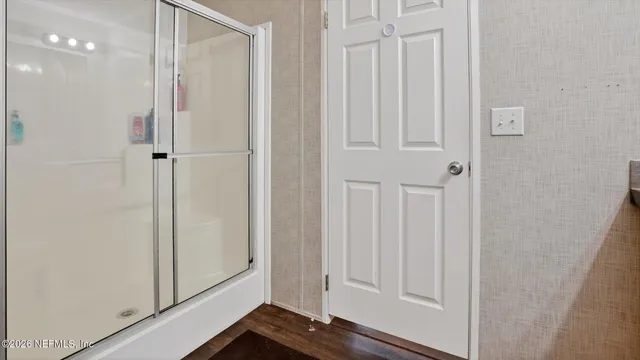a view of a bathroom with mirror