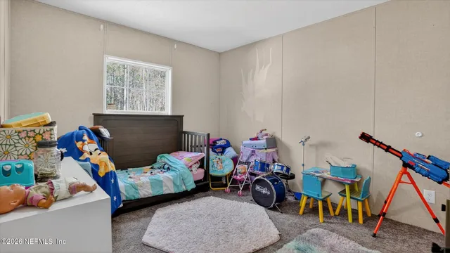 a children room with furniture and toys