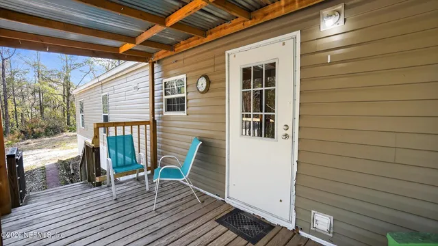 a view of a backyard with large trees