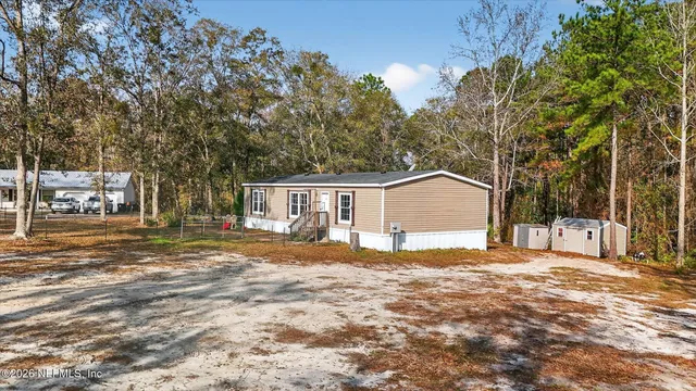 a backyard of a house with lots of green space