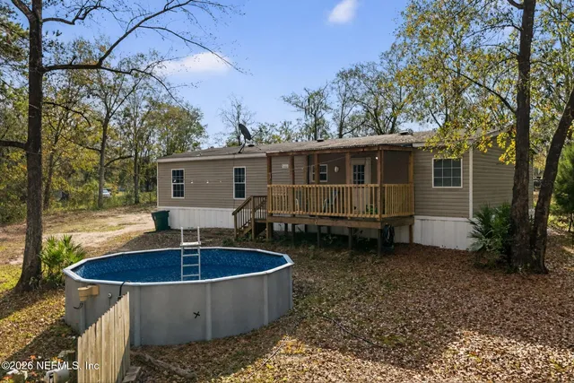 a view of a water fountain in a forest