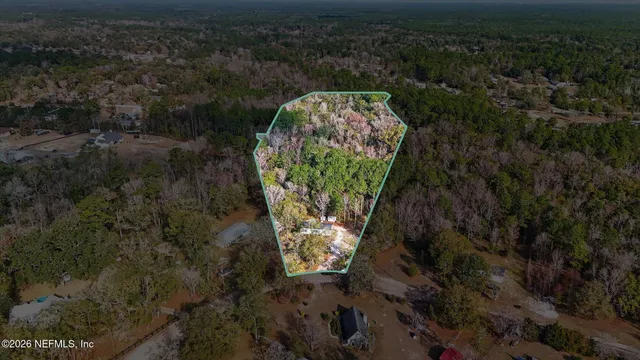 a backyard of a building with large trees