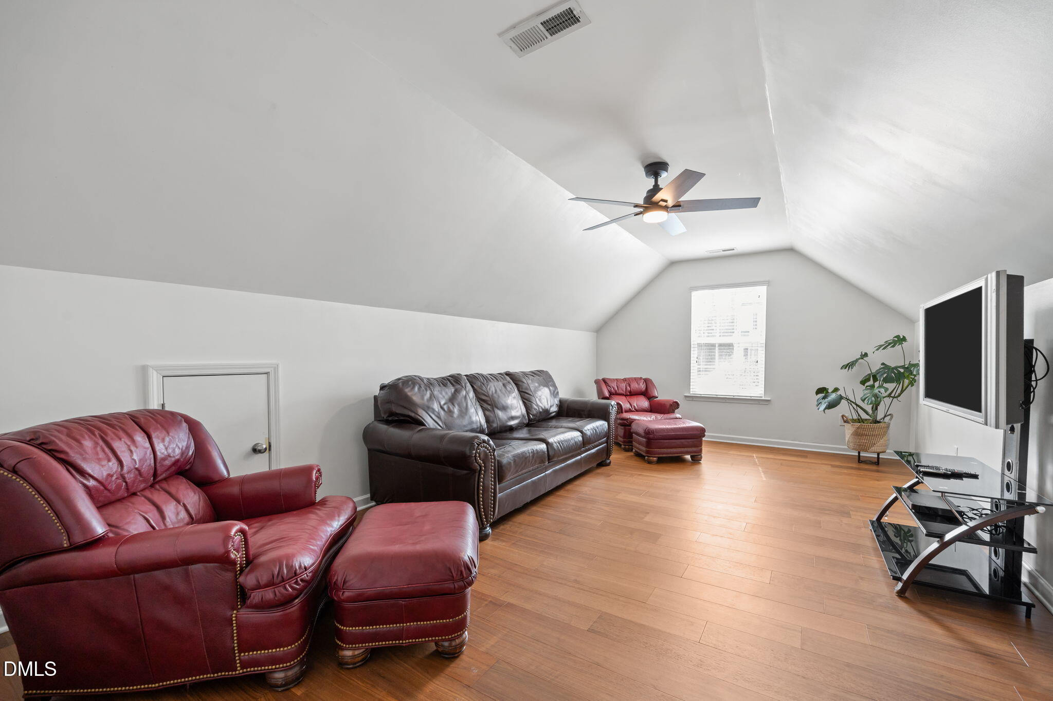 5049 Jelynn Street Raleigh, NC 27616 - Photo 19 of 33 a living room with furniture and a flat screen tv