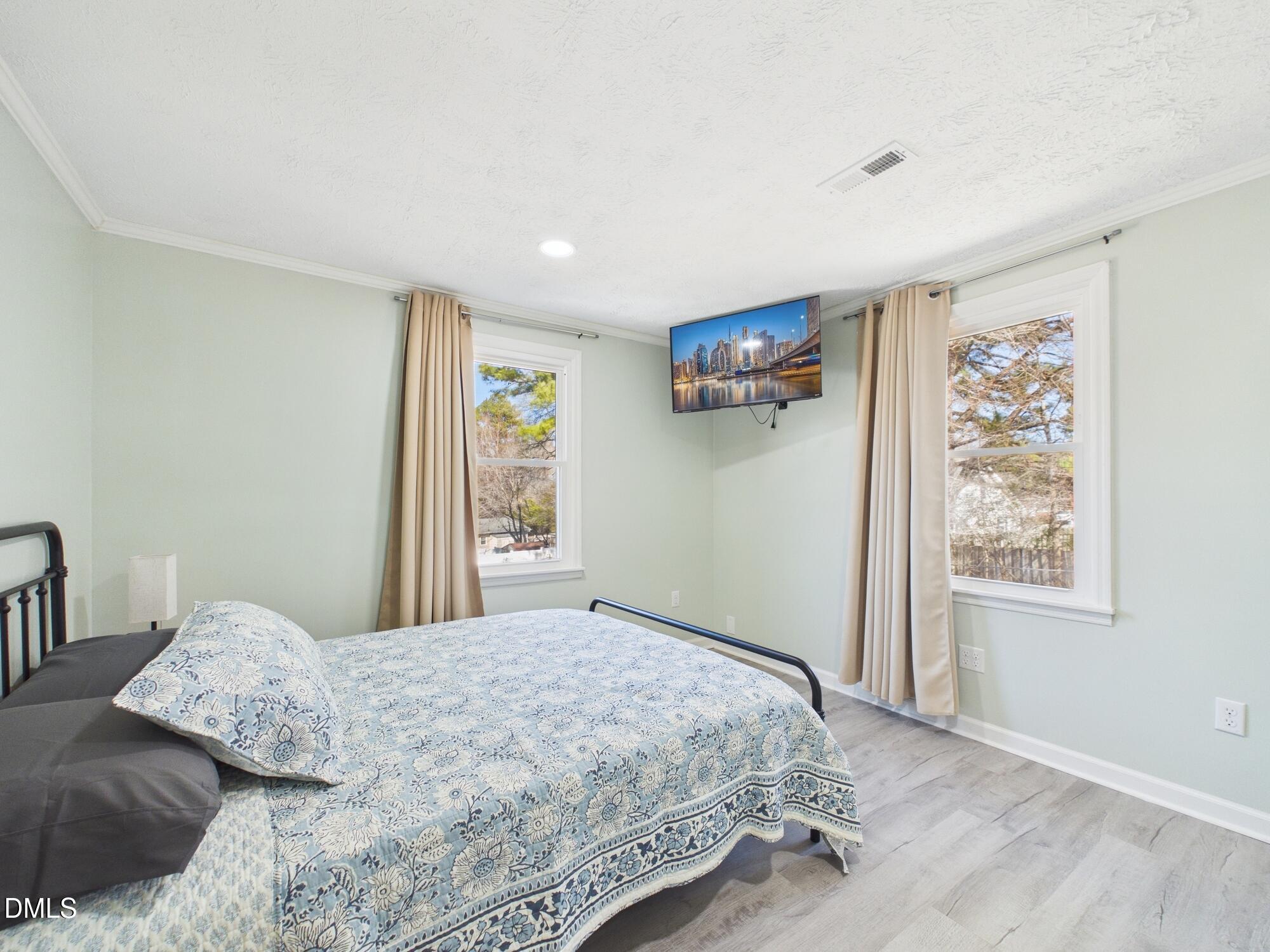 72 Edgemont Avenue Roxboro, NC 27573 - Photo 16 of 45 a bedroom with a bed and a window