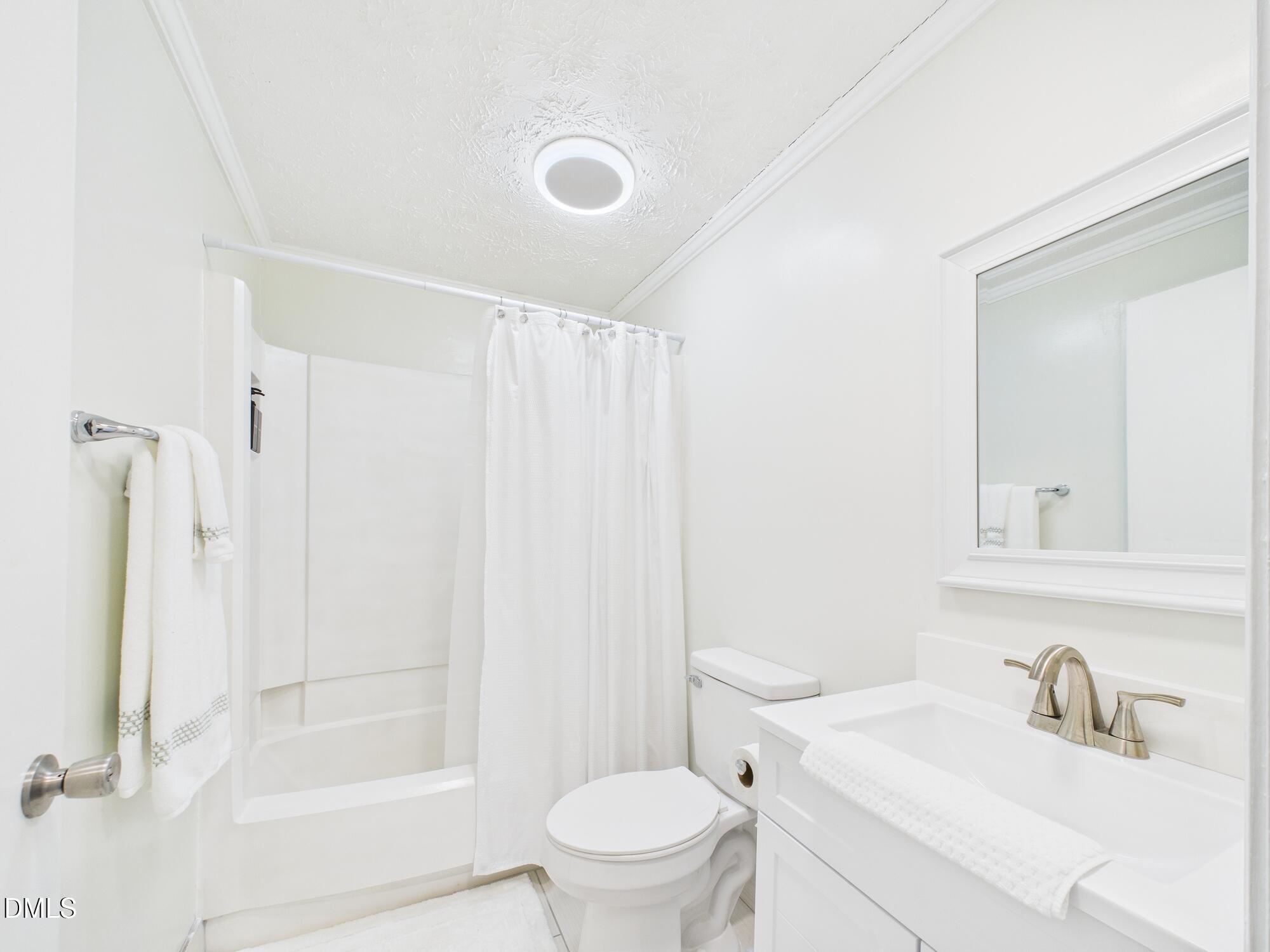 72 Edgemont Avenue Roxboro, NC 27573 - Photo 17 of 45 a bathroom with a sink toilet and shower