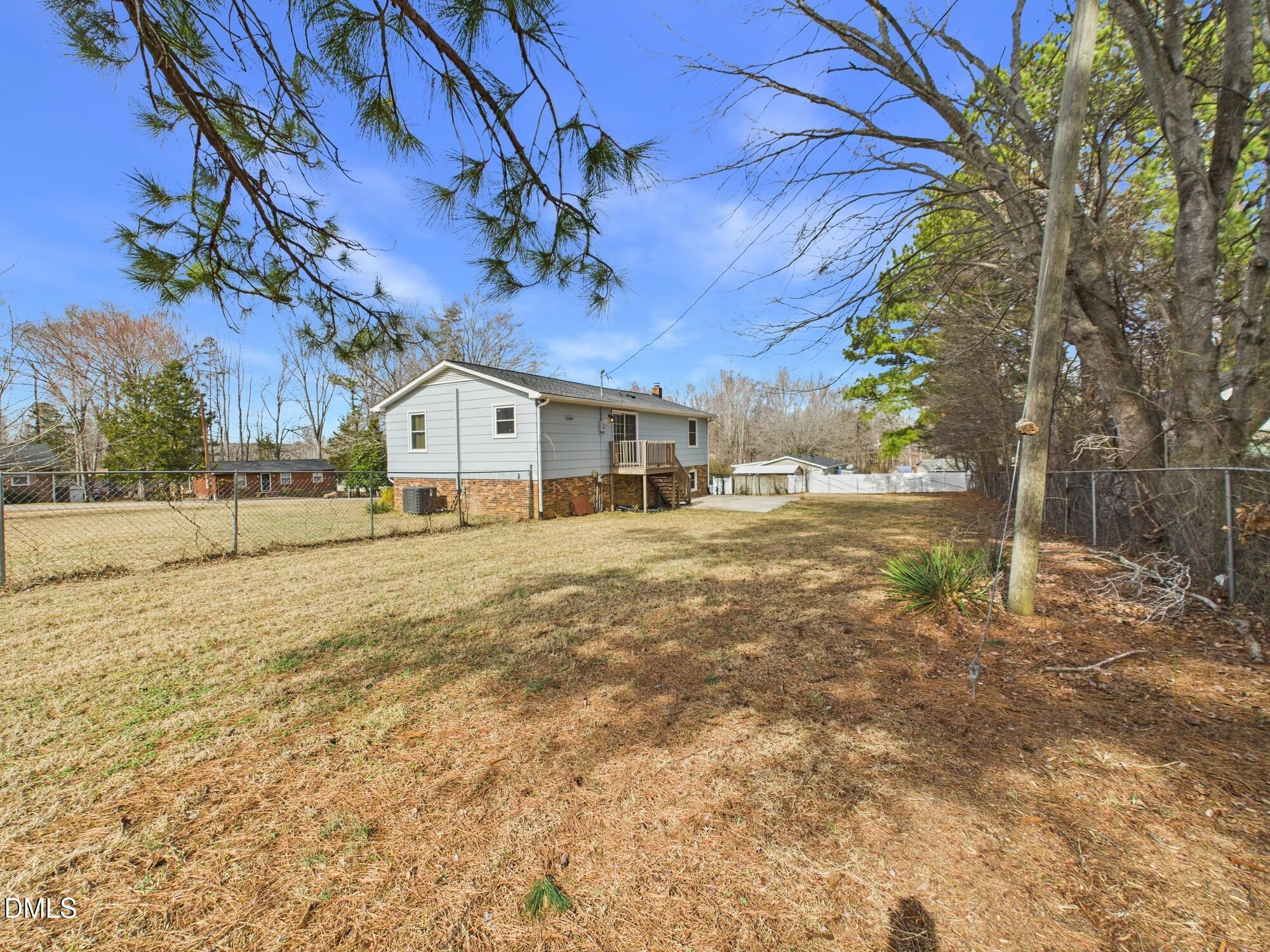 72 Edgemont Avenue Roxboro, NC 27573 - Photo 28 of 45 a white house with tree in front of it