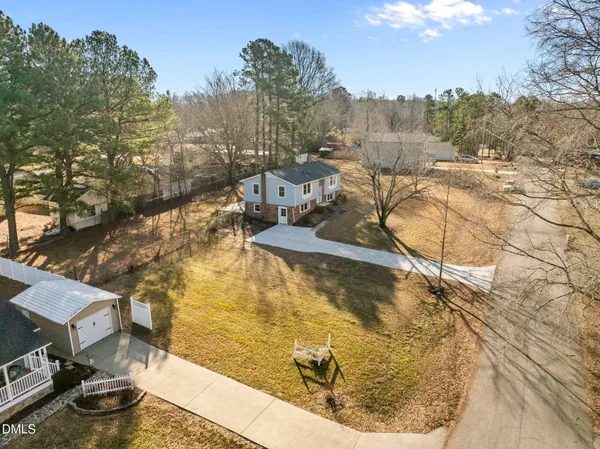 a view of a yard with trees