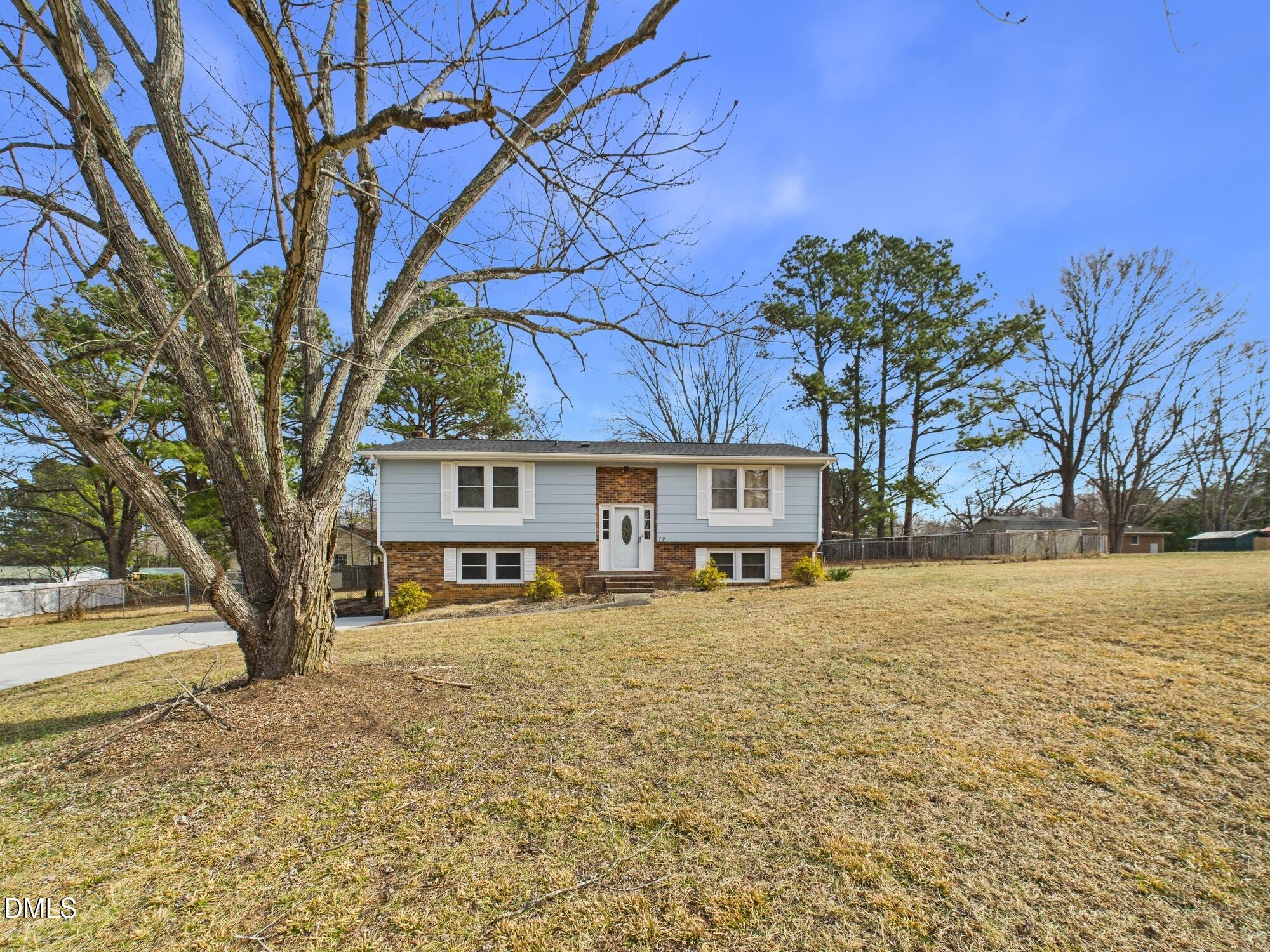 72 Edgemont Avenue Roxboro, NC 27573 - Photo 39 of 45 a house that has a tree in front of it