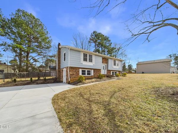 front view of a house with a yard