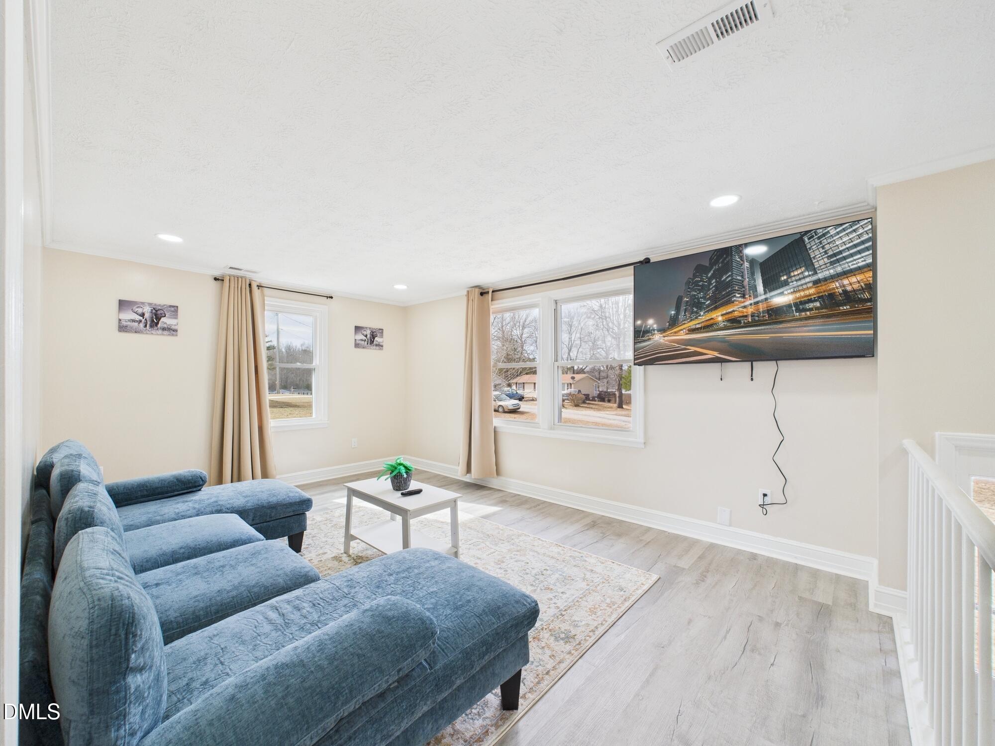 72 Edgemont Avenue Roxboro, NC 27573 - Photo 4 of 45 a living room with furniture and a table