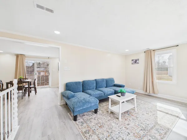 a living room with furniture and a table