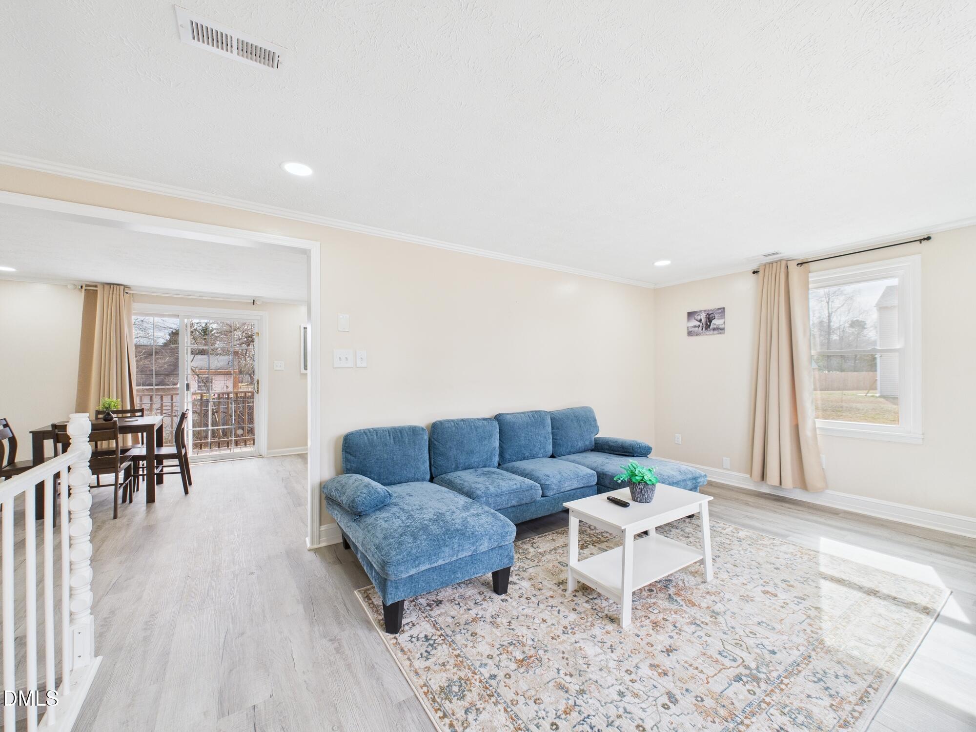 72 Edgemont Avenue Roxboro, NC 27573 - Photo 6 of 45 a living room with furniture and a wooden floor