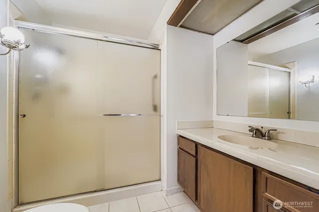a bathroom with a sink and mirror