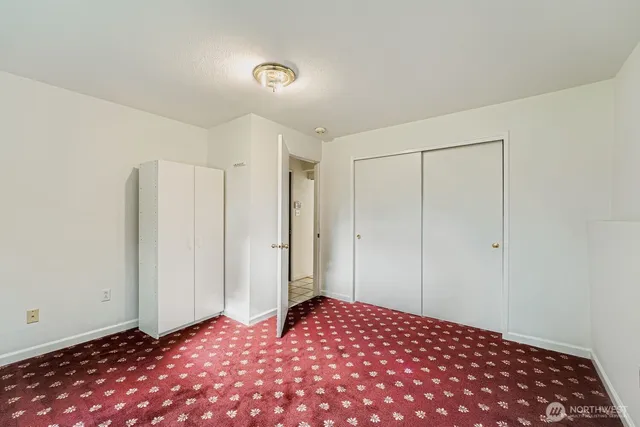 a bedroom with a bed and a shower