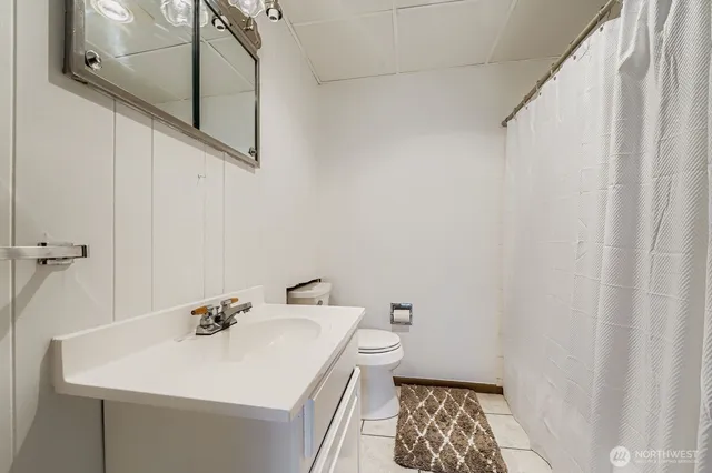 a bathroom with a sink toilet and vanity