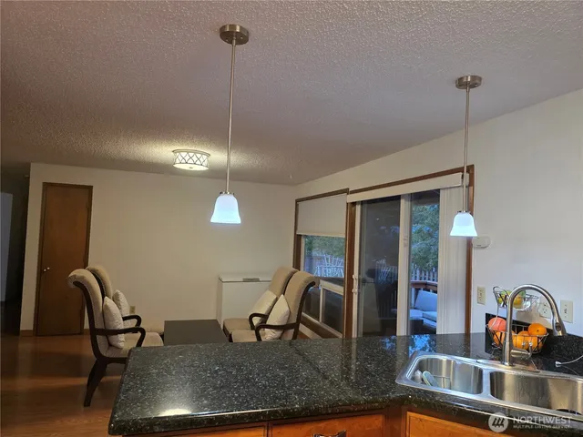 a view of a kitchen area and dining room