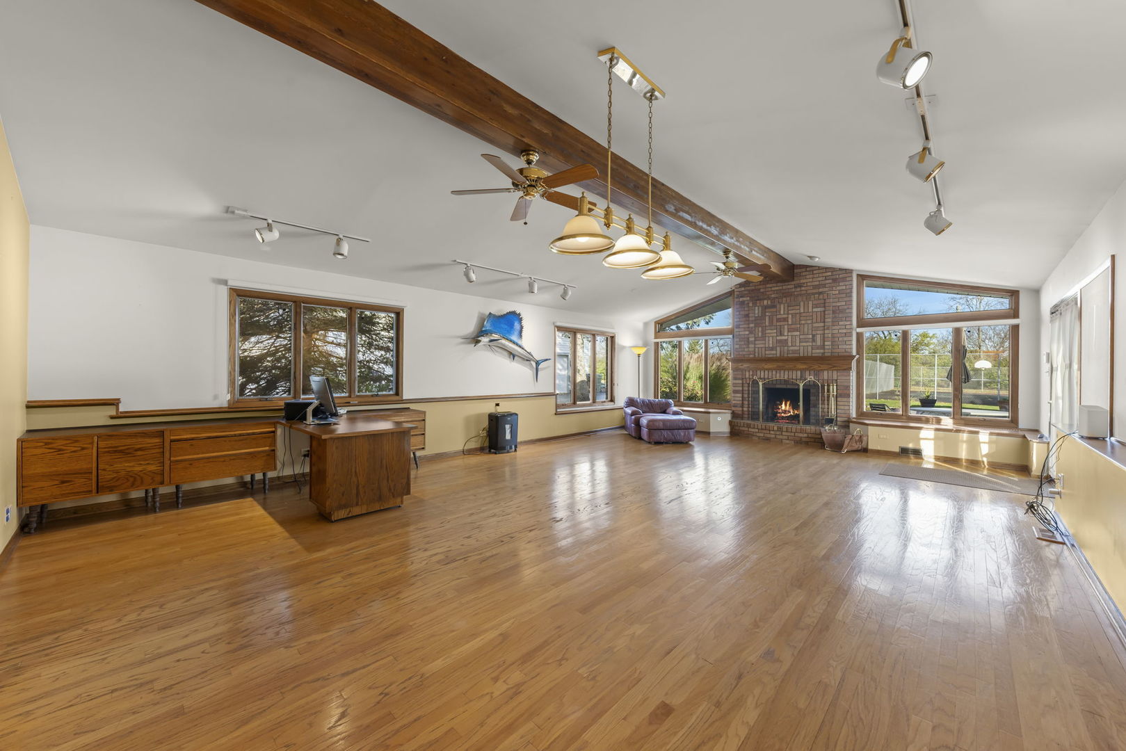3068 Hickory Road Homewood, IL 60430 - Photo 12 of 44 a view of a living room and kitchen with furniture wooden floor and windows
