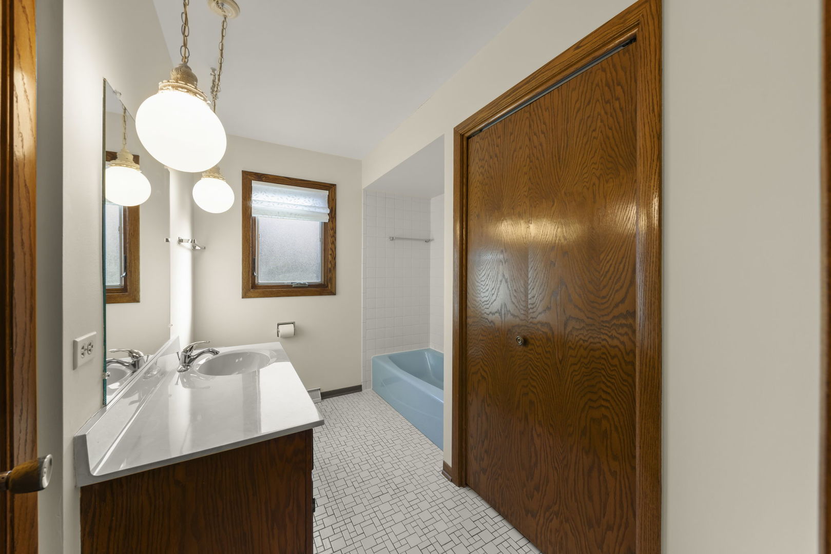 3068 Hickory Road Homewood, IL 60430 - Photo 17 of 44 a bathroom with a sink a light fixture and a mirror