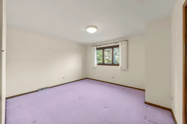 an empty room with a empty space and window