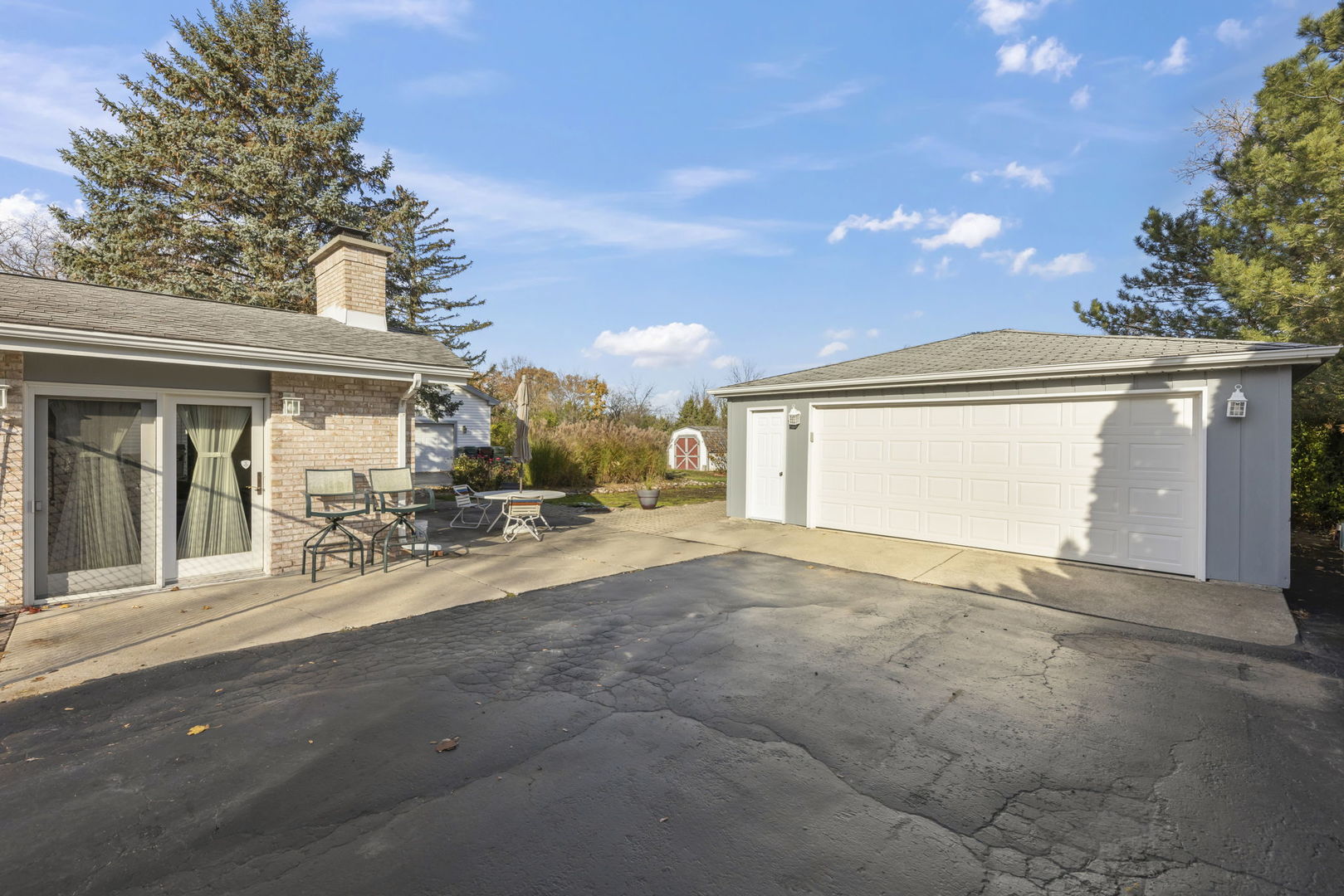 3068 Hickory Road Homewood, IL 60430 - Photo 23 of 44 a view of a house with a patio and a yard